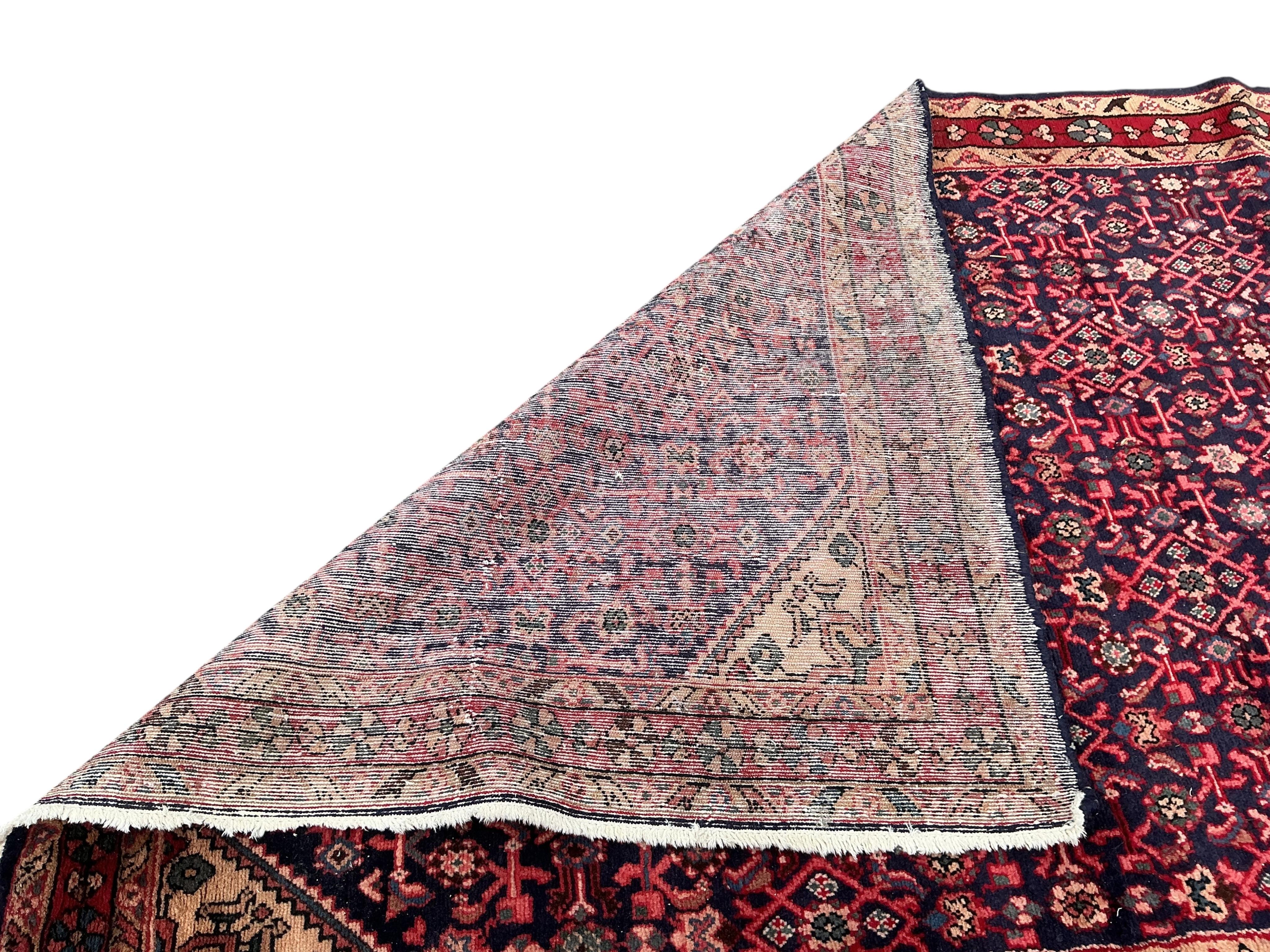 A Hamadan red ground carpet, 282 x 159cm